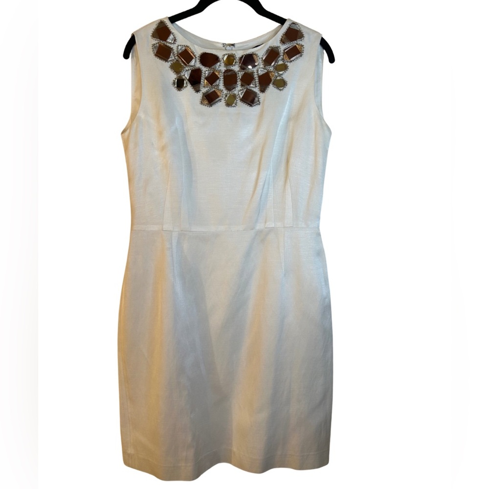 Elegant Cream Sleeveless Dress with Embellished Neckline